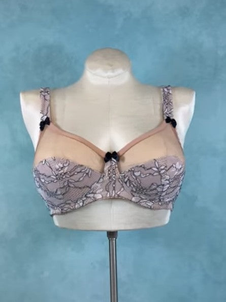 Lace bra on a mannequin against a blue background