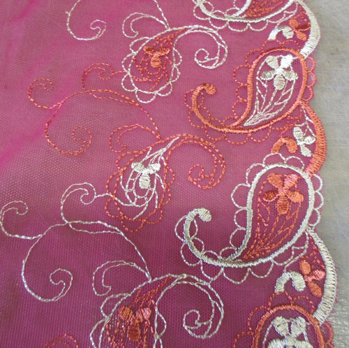 Cerise non-stretch lace with orange and gold embroidery